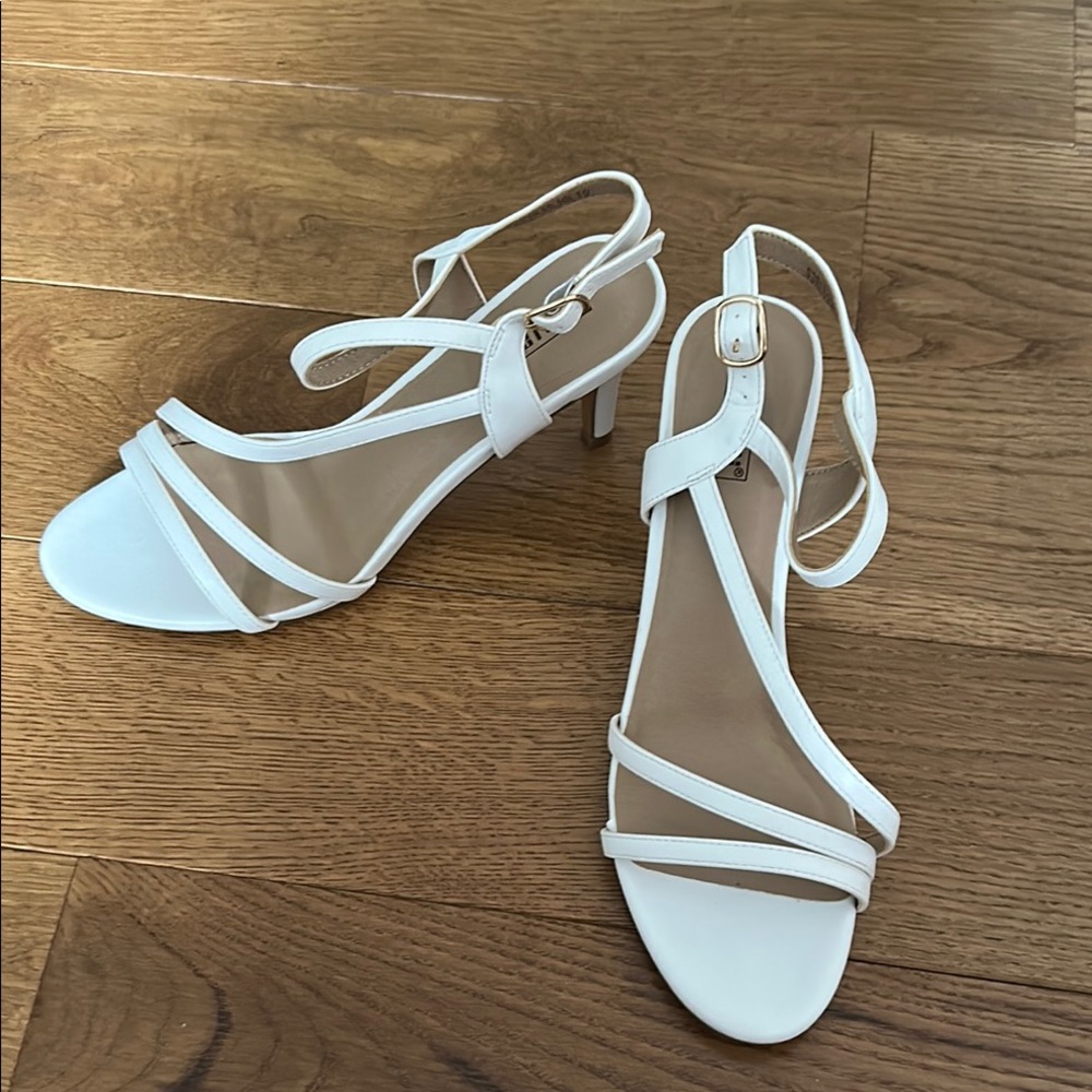 White Heeled Sandals with Adjustable Straps. Used once for couple hours .